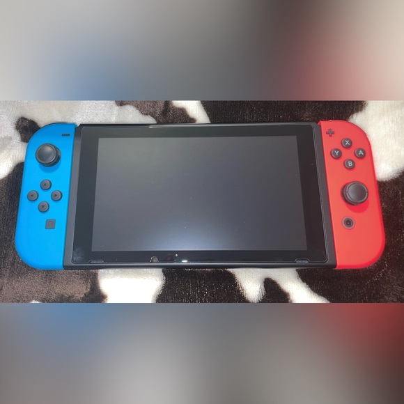 Nintendo Switch with Red and Blue Joy-Cons and Star Case